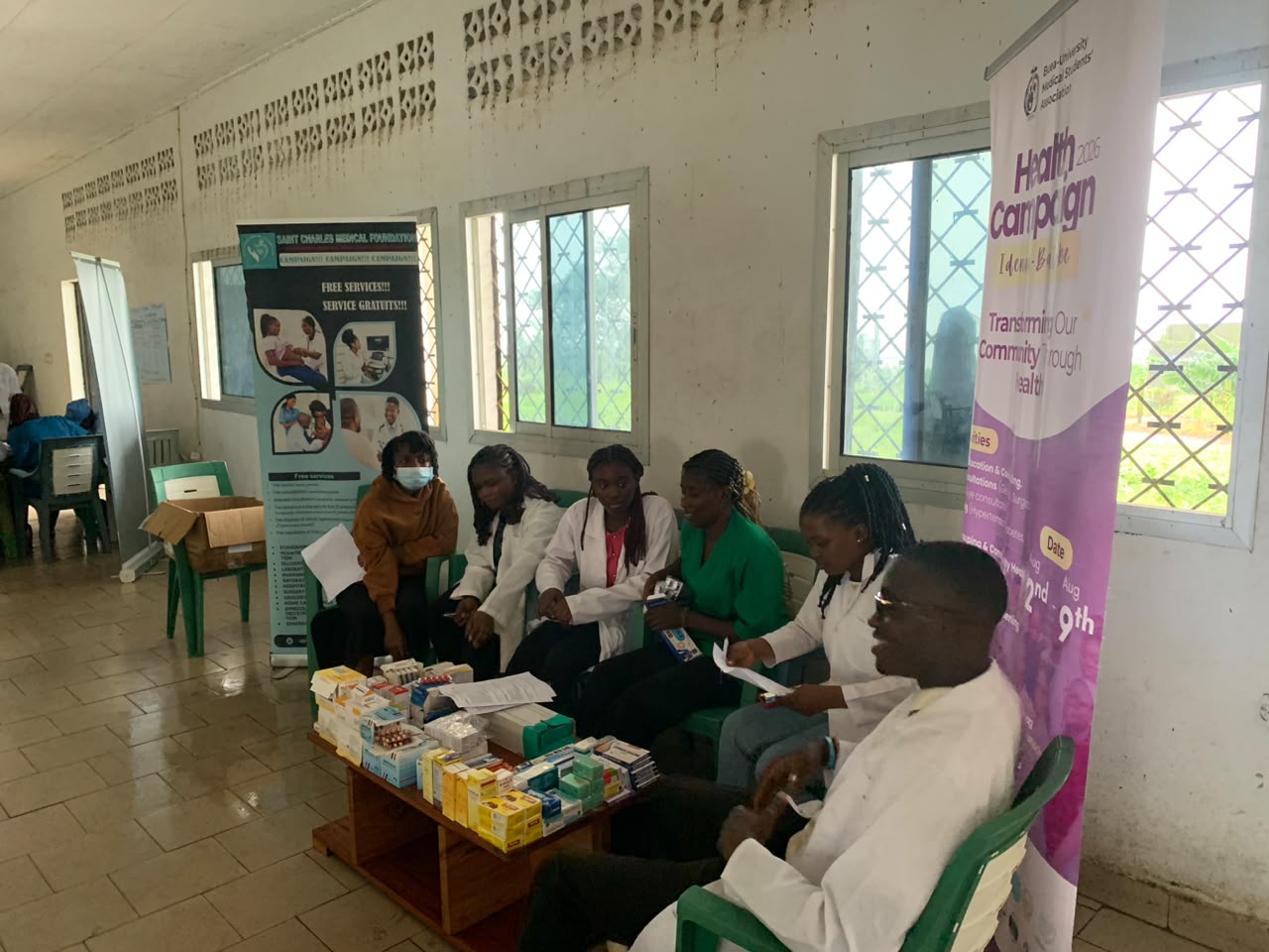 Volunteer measuring blood pressure during vital signs assessment in Mokundange